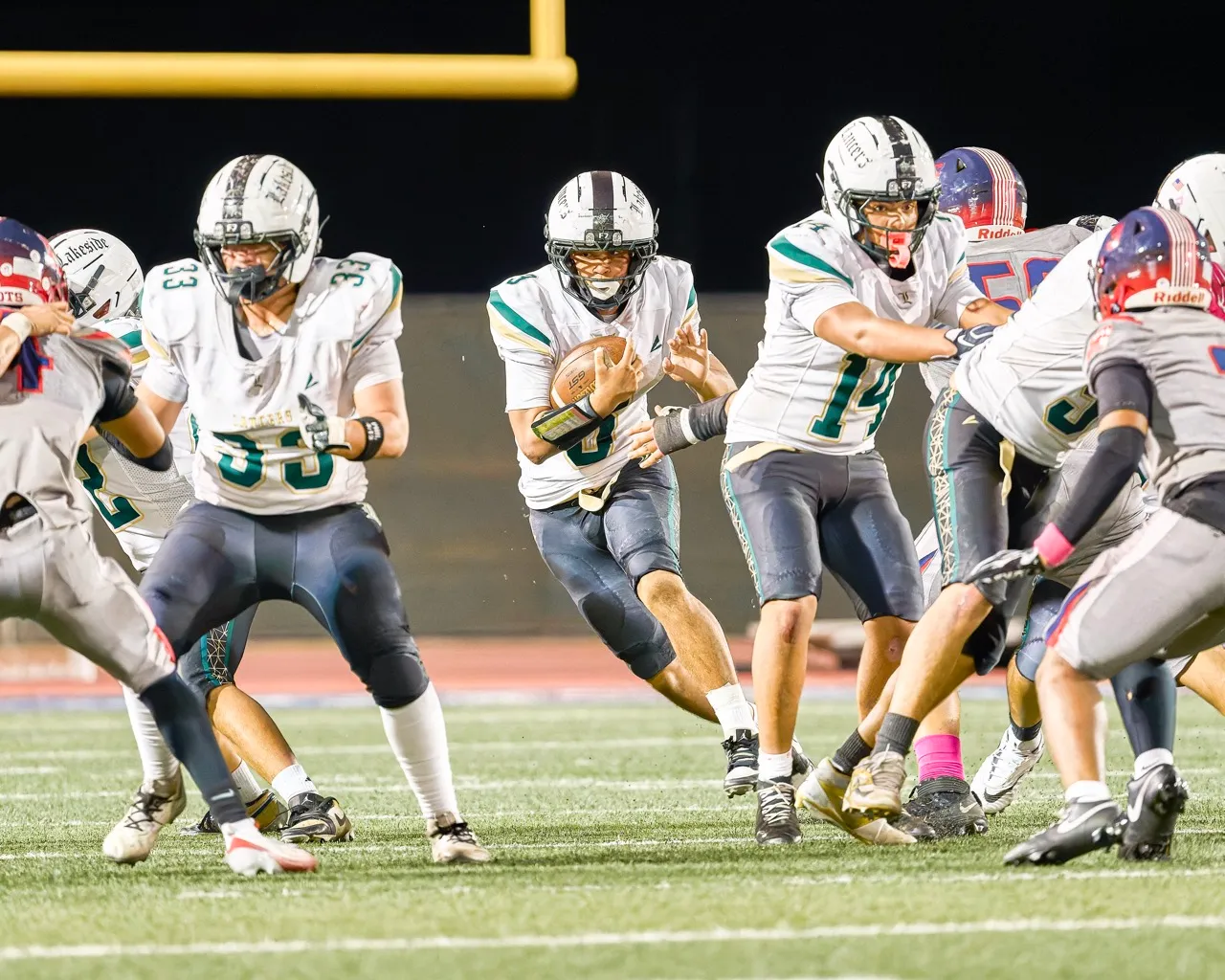 Lakeside’s RB Daniel Keith (3) finds the hole on a handoff to keep lakeside moving the chains. Photo by Marcus Walker