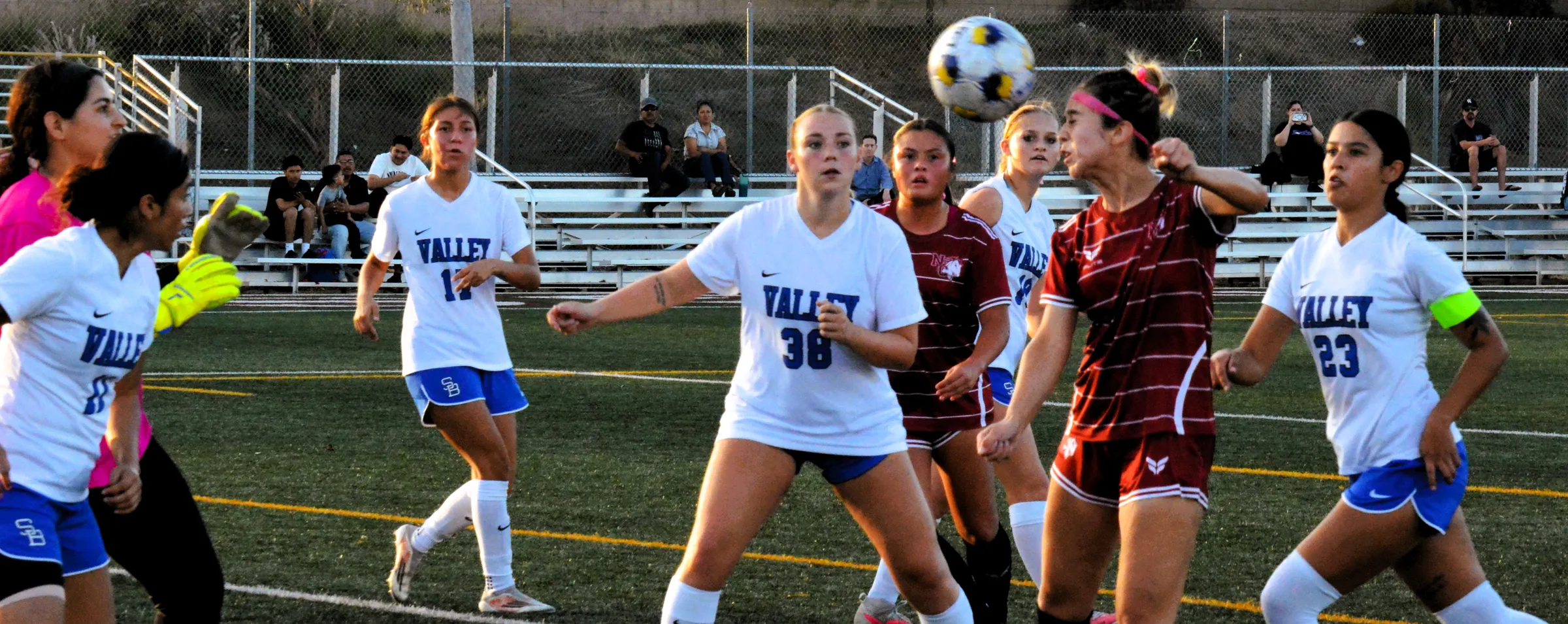 Norco College’s Brianna Reyes (second from right) puts a header on goal while surrounded by San Bernardino Valley College goalie Zamantha Moctezuma Ibarra (left), Yuliana Reyes (11), Natalie Guerro (17), Darby Shannon (38),  Ava Brown (19), and Desiree Aguilar (23).  Ibarra deflected the shot, and the Wolverines defeated the Mustangs 4 – 0.