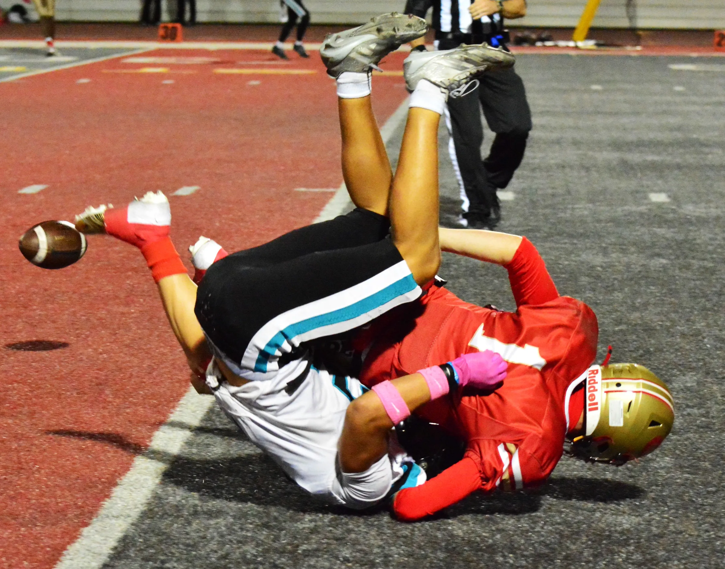 Corona defender Dayton McNeil denied Santiago receiver Carter Ward the ball during a second-quarter pass attempt. The duo battled throughout the game, as the Sharks scored two second-half touchdowns to beat the Panthers 14 – 0. Credit: Photo by Gary Evans