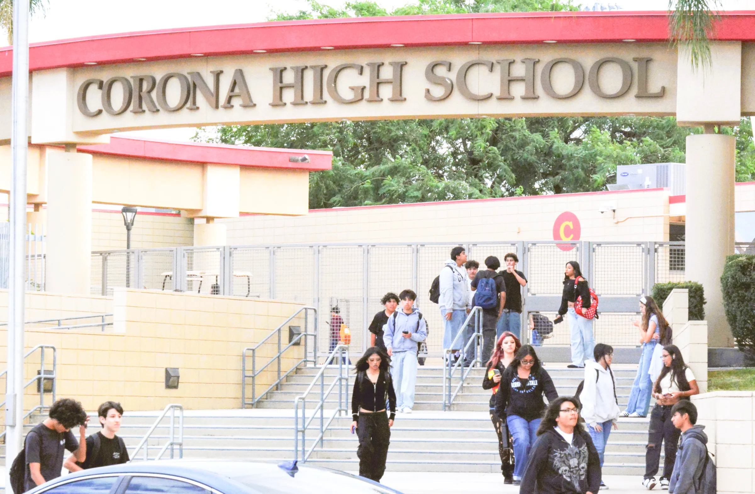Students leave Corona High at dismissal on Wednesday, after learning a schoolmate is accused of planning a mass shooting at the school. Credit: Photo by Gary Evans
