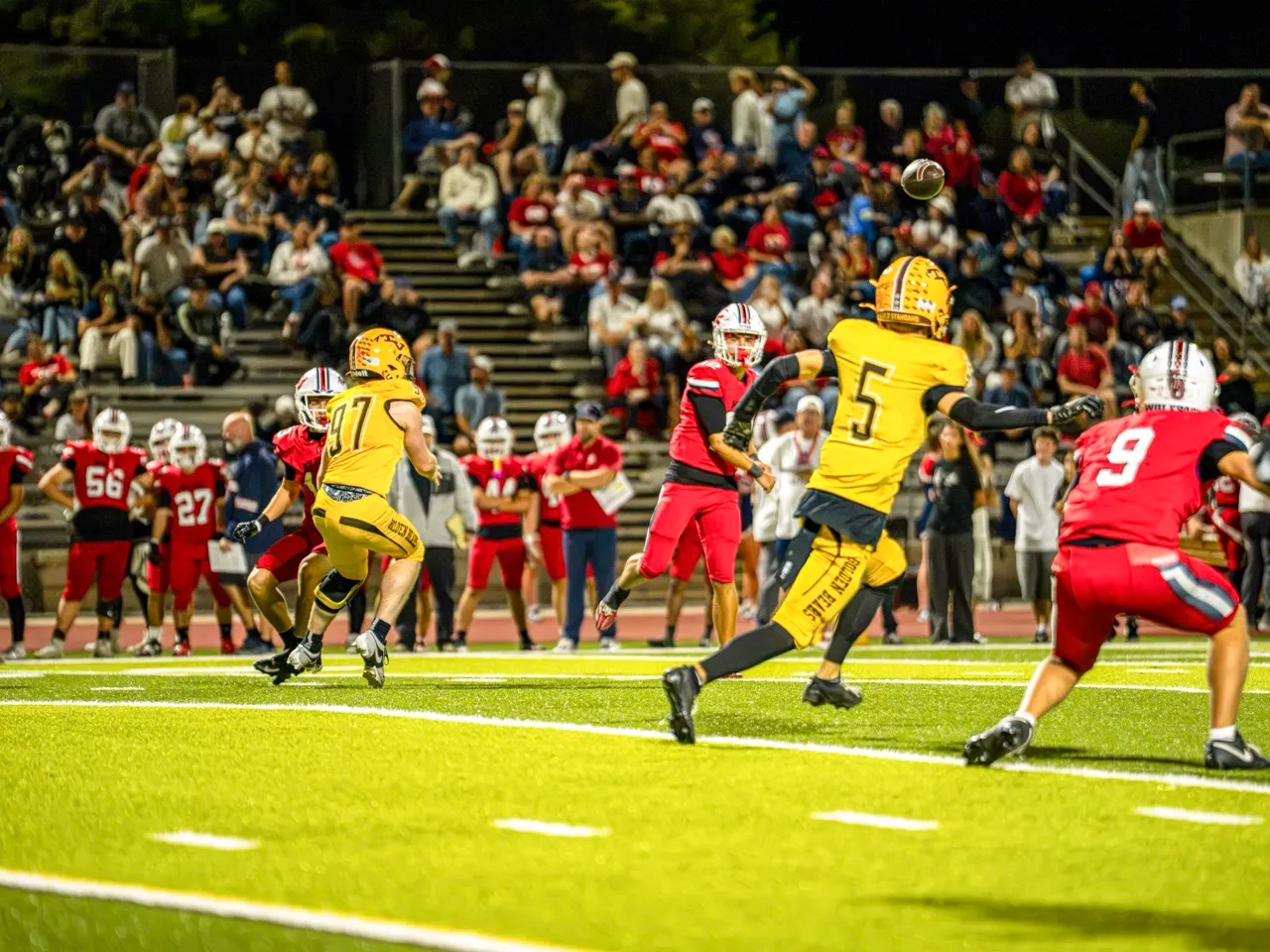 Great Oak Quarterback, Trent Lux (12), Completes a pass for a Great Oak first down. The Great Oak Wolfpack beat the  Temecula Valley Golden Bears 33-10, Friday, Ocotber 16. Photo by Brian Umali